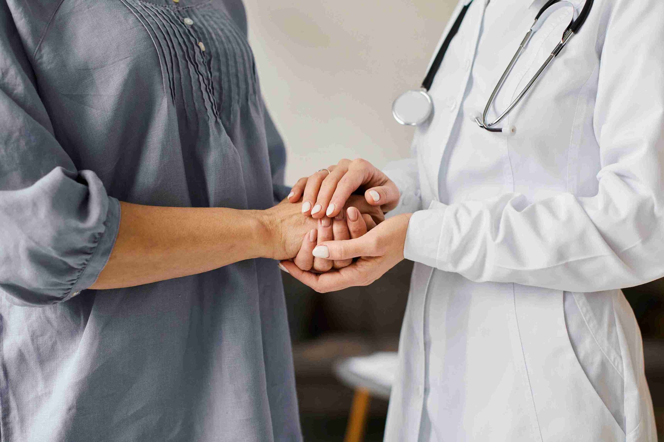 covid-recovery-center-female-doctor-holding-older-patient-s-hands_11zon